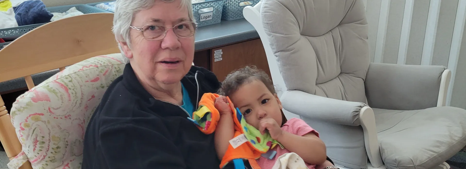 Grandma Ann holding a child